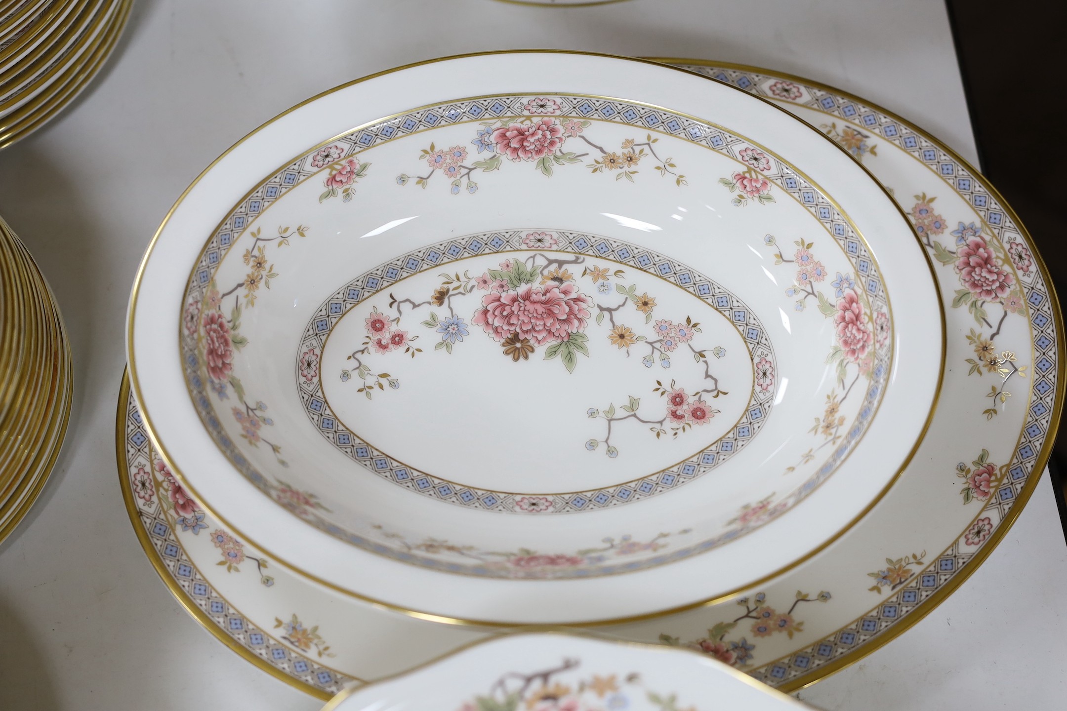 An extensive Royal Doulton Canton pattern dinner service as used by The Queen and Paddington bear in the Jubilee sketch